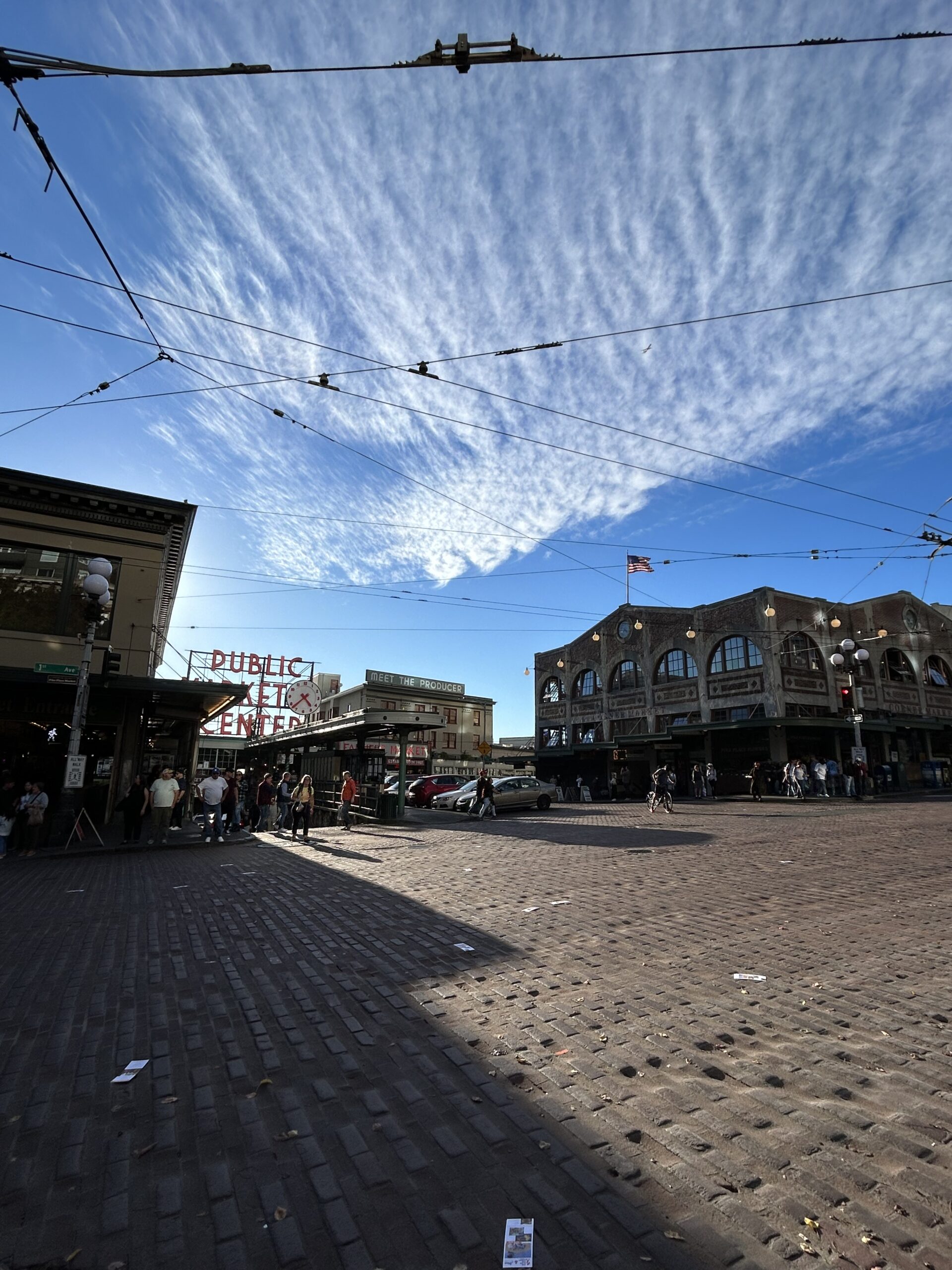 blue sky, brick road, market in the background